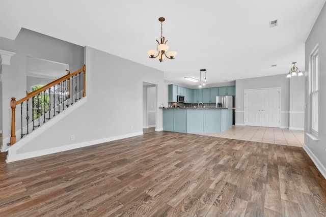 5000 Loch Lorne Ct, Mount Juliet, TN 37122 - unfurnished living room with a chandelier, wood finished floors, and stairs