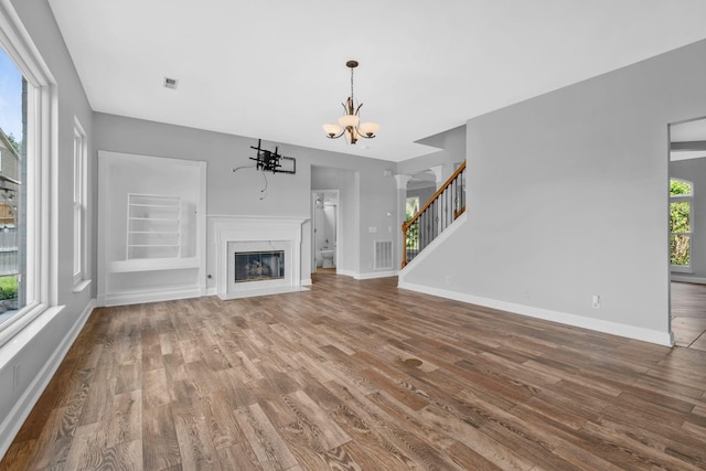 5000 Loch Lorne Ct, Mount Juliet, TN 37122 - unfurnished living room with wood finished floors, a chandelier, and stairway