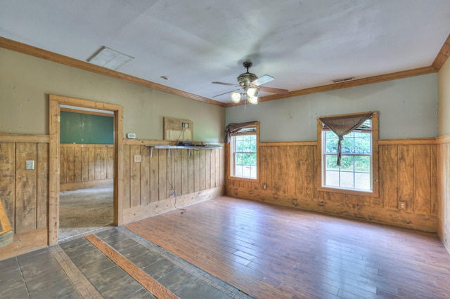 417 Haskins Chapel Rd, Lewisburg, TN 37091 - empty room with wainscoting, wooden walls, ceiling fan, ornamental molding, and wood finished floors