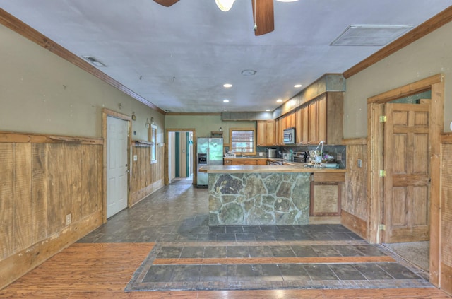 417 Haskins Chapel Rd, Lewisburg, TN 37091 - kitchen featuring stainless steel appliances, crown molding, brown cabinets, ceiling fan, and a peninsula