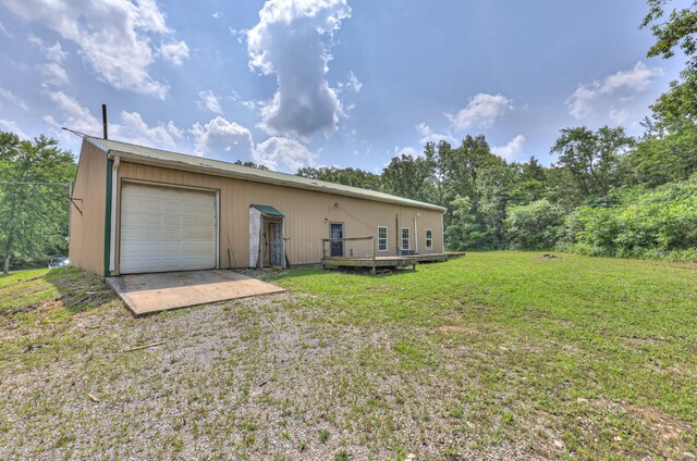 417 Haskins Chapel Rd, Lewisburg, TN 37091 - rear view of house featuring a yard, a deck, driveway, and a garage