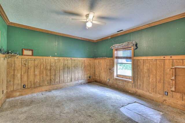 417 Haskins Chapel Rd, Lewisburg, TN 37091 - empty room with ornamental molding, ceiling fan, wooden walls, a textured ceiling, and carpet flooring