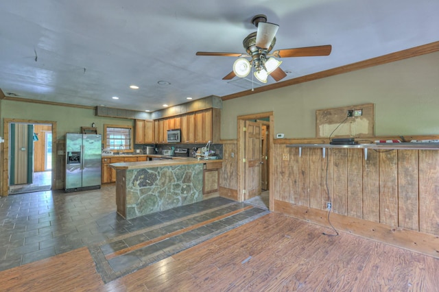 417 Haskins Chapel Rd, Lewisburg, TN 37091 - kitchen with stainless steel appliances, ornamental molding, brown cabinets, a ceiling fan, and a peninsula