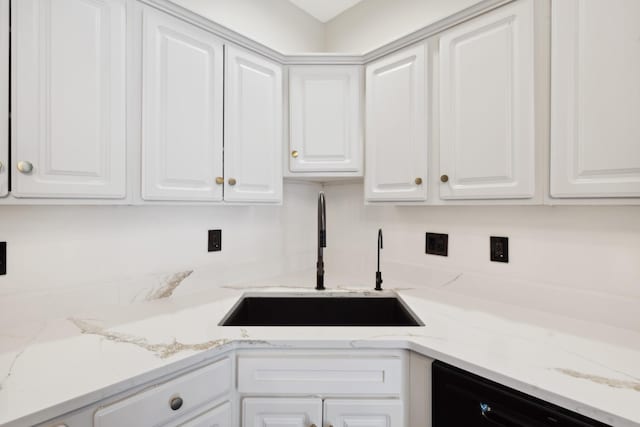 127 Carriage Ct, Brentwood, TN 37027 - kitchen featuring a sink, dishwasher, white cabinets, and light stone countertops