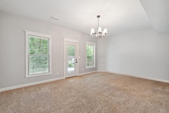 127 Carriage Ct, Brentwood, TN 37027 - spare room featuring a chandelier, light carpet, and baseboards