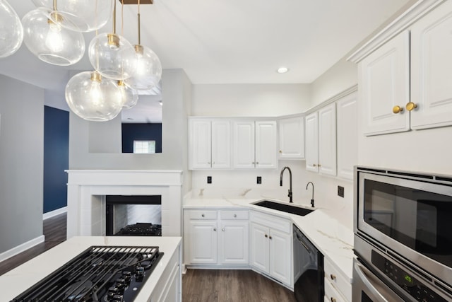 127 Carriage Ct, Brentwood, TN 37027 - kitchen with black appliances, dark wood-style flooring, a sink, white cabinets, and recessed lighting