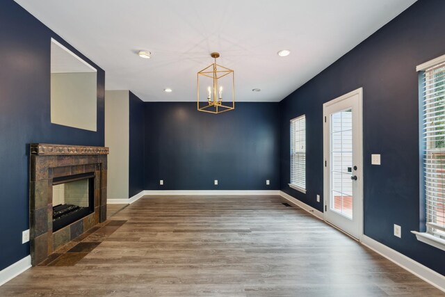127 Carriage Ct, Brentwood, TN 37027 - unfurnished living room featuring a chandelier, wood finished floors, a tile fireplace, and recessed lighting