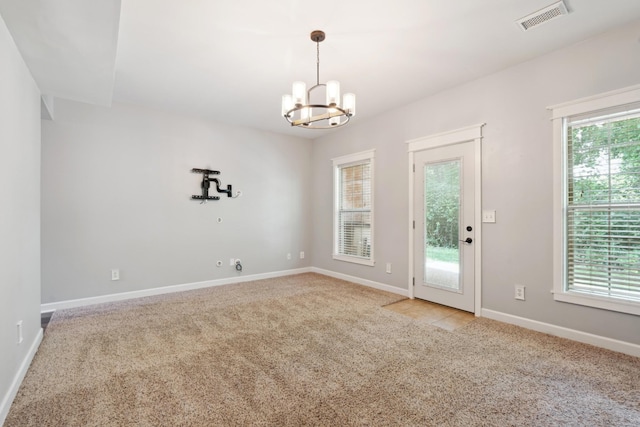 127 Carriage Ct, Brentwood, TN 37027 - empty room with light colored carpet, a chandelier, plenty of natural light, and baseboards