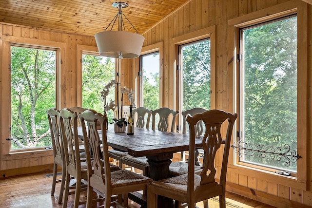 2541 Sparkmantown Rd, Doyle, TN 38559 - dining room with vaulted ceiling, wood walls, wooden ceiling, and light wood-style flooring