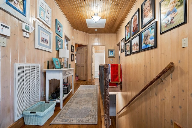 2541 Sparkmantown Rd, Doyle, TN 38559 - hallway with wood finished floors, wooden ceiling, wooden walls, and a heating unit