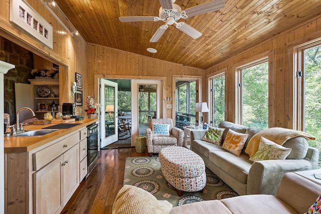 2541 Sparkmantown Rd, Doyle, TN 38559 - living area featuring wood walls, wine cooler, vaulted ceiling, a ceiling fan, and dark wood-type flooring