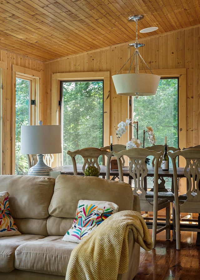 2541 Sparkmantown Rd, Doyle, TN 38559 - dining area featuring wood walls, wooden ceiling, and hardwood / wood-style floors