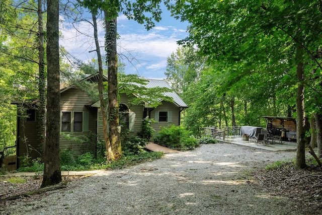 2541 Sparkmantown Rd, Doyle, TN 38559 - view of property exterior with a patio area and a metal roof