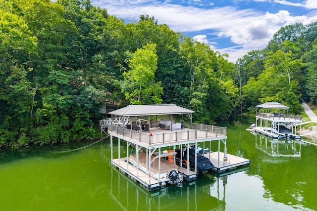 2541 Sparkmantown Rd, Doyle, TN 38559 - dock with boat lift, a water view, and a forest view