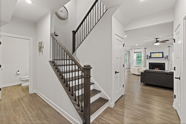 3067 Boxbury Ln, Spring Hill, TN 37174 - stairway with ceiling fan, wood finished floors, a warm lit fireplace, and recessed lighting