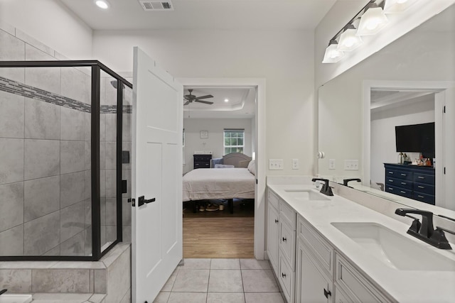 3067 Boxbury Ln, Spring Hill, TN 37174 - ensuite bathroom with double vanity, a shower stall, tile patterned floors, a ceiling fan, and recessed lighting