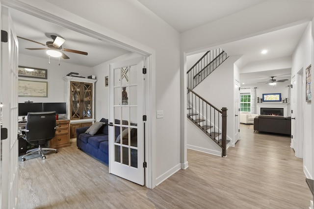 3067 Boxbury Ln, Spring Hill, TN 37174 - home office with ceiling fan, wood finished floors, and a lit fireplace