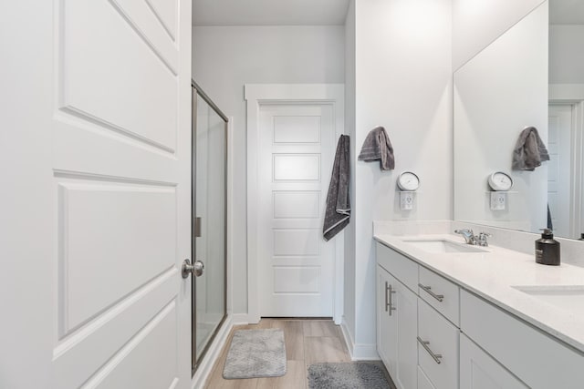 755 Mickelson Way, Lebanon, TN 37087 - bathroom with a shower stall, double vanity, and wood finished floors