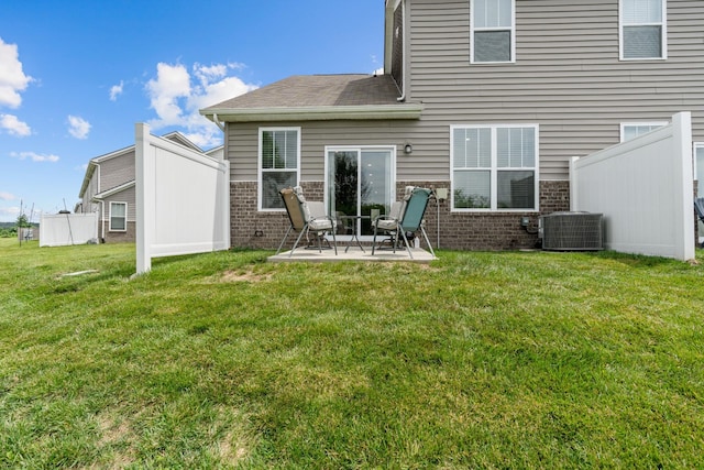 755 Mickelson Way, Lebanon, TN 37087 - back of house featuring brick siding, a patio area, and a yard