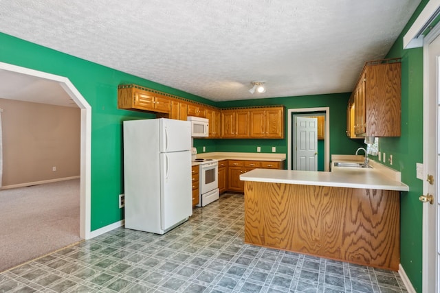 4524 Polaris Dr, Chapel Hill, TN 37034 - kitchen featuring white appliances, a sink, a peninsula, light countertops, and a textured ceiling