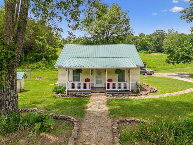 2665 Center Point Rd, Pulaski, TN 38478 - view of front facade featuring a porch, a front yard, and metal roof