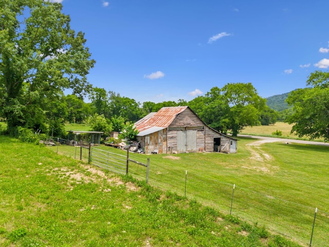 2665 Center Point Rd, Pulaski, TN 38478 - view of side of property with a barn and an outbuilding