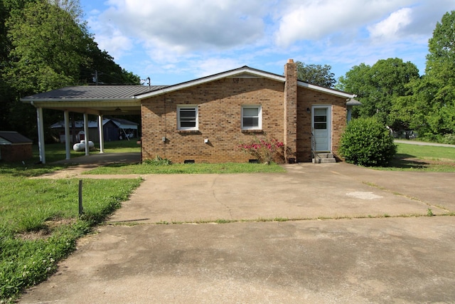 680 Oak Grove Rd, Goodspring, TN 38460 - rear view of property featuring a chimney, crawl space, brick siding, an attached carport, and entry steps