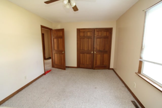 680 Oak Grove Rd, Goodspring, TN 38460 - unfurnished bedroom featuring carpet floors, baseboards, and a ceiling fan