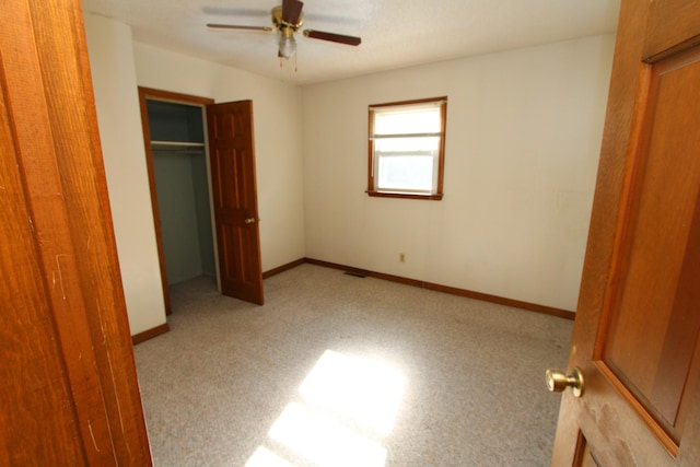 680 Oak Grove Rd, Goodspring, TN 38460 - unfurnished bedroom featuring a closet, baseboards, and ceiling fan