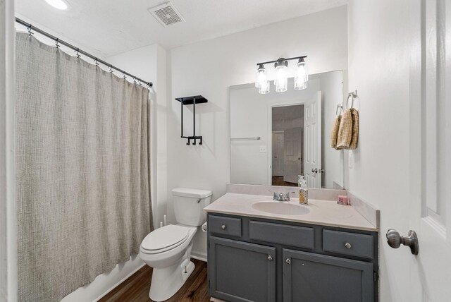 2930 Charlie Sleigh Rd, Woodlawn, TN 37191 - full bathroom with vanity, wood finished floors, and shower / bath combo with shower curtain
