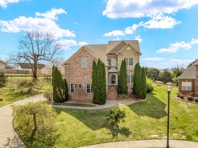 3105 Appian Way, Spring Hill, TN 37174 - traditional-style home with brick siding and a front lawn