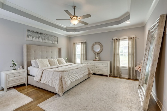 1105 Kittywood Ct, Murfreesboro, TN 37129 - bedroom with a tray ceiling, multiple windows, wood finished floors, recessed lighting, and crown molding