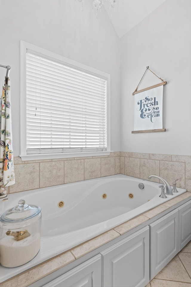 6523 Brigade Ln, Hixson, TN 37343 - bathroom with a tub with jets, healthy amount of natural light, and lofted ceiling
