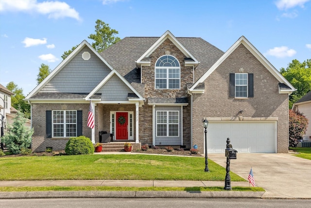 6523 Brigade Ln, Hixson, TN 37343 - view of front of property with driveway, an attached garage, a front yard, and brick siding