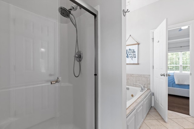 6523 Brigade Ln, Hixson, TN 37343 - full bath with a shower stall, ensuite bath, tile patterned flooring, and a tub with jets