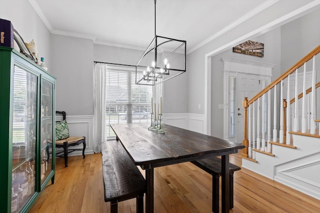 6523 Brigade Ln, Hixson, TN 37343 - dining space featuring plenty of natural light, stairway, a chandelier, light wood-style flooring, and crown molding