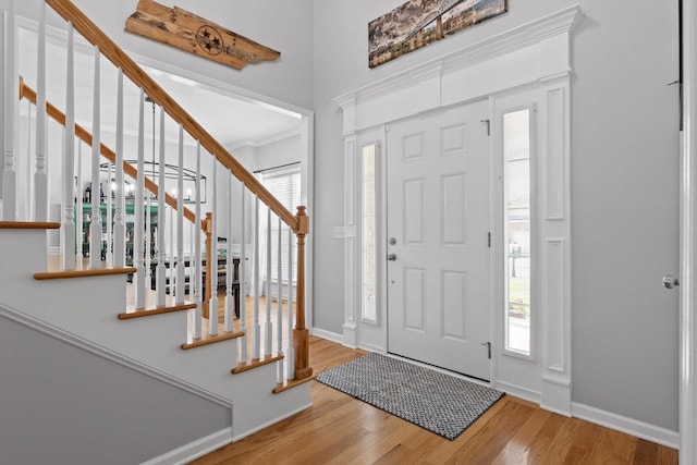 6523 Brigade Ln, Hixson, TN 37343 - entryway featuring wood finished floors, stairs, baseboards, and plenty of natural light