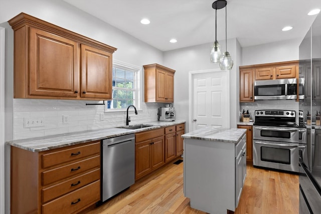 6523 Brigade Ln, Hixson, TN 37343 - kitchen with stainless steel appliances, a sink, backsplash, light stone counters, and recessed lighting