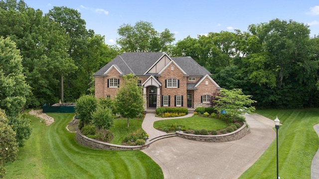 8255 Jamie Ct, Brentwood, TN 37027 - view of front of home featuring brick siding and a front lawn