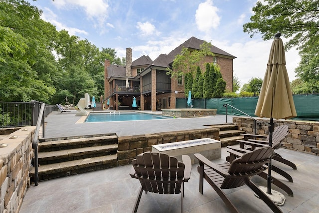 8255 Jamie Ct, Brentwood, TN 37027 - view of pool featuring stairs, a patio area, and a fire pit
