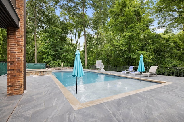8255 Jamie Ct, Brentwood, TN 37027 - view of swimming pool featuring a patio and view of wooded area