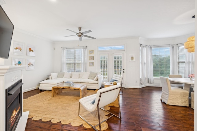 641 Old Hickory Blvd Unit 35, Brentwood, TN 37027 - living area with a warm lit fireplace, crown molding, ceiling fan, dark wood-type flooring, and baseboards