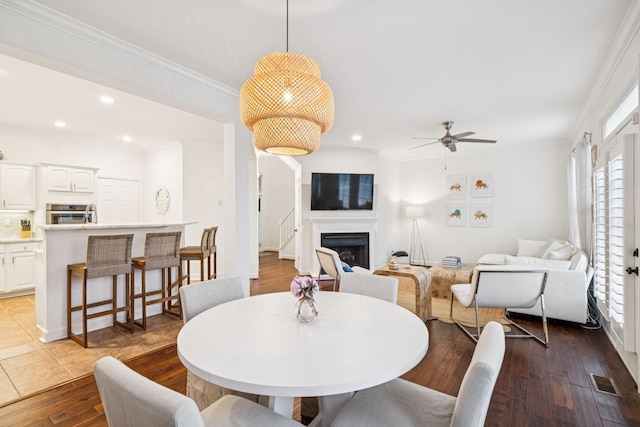 641 Old Hickory Blvd Unit 35, Brentwood, TN 37027 - dining space with a fireplace, hardwood / wood-style floors, a ceiling fan, recessed lighting, and ornamental molding