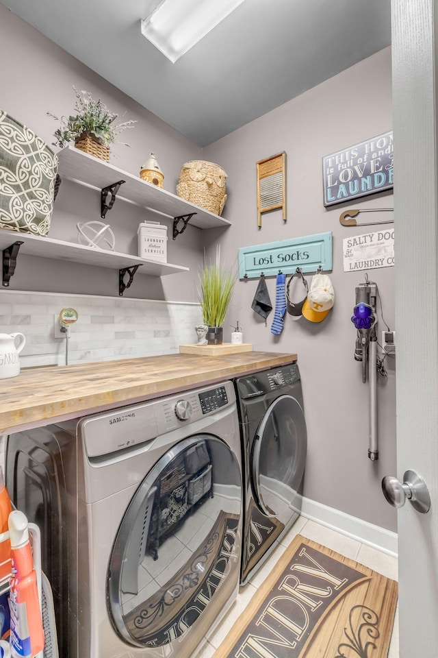 2988 Barnstable Ct, Murfreesboro, TN 37127 - laundry room featuring tile patterned flooring, washing machine and dryer, and baseboards