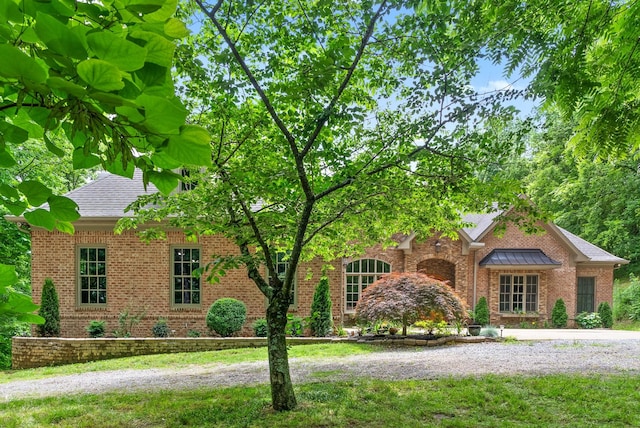 6779 Arno Allisona Rd, College Grove, TN 37046 - view of front facade featuring brick siding and roof with shingles