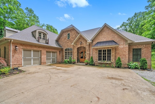 6779 Arno Allisona Rd, College Grove, TN 37046 - view of front of house with brick siding, driveway, french doors, and an attached garage