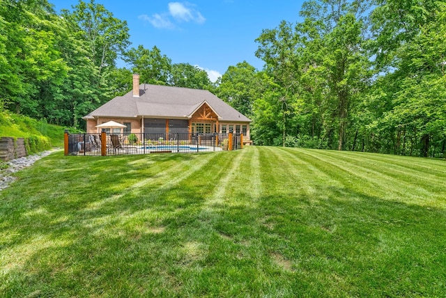6779 Arno Allisona Rd, College Grove, TN 37046 - rear view of property featuring a chimney, a sunroom, and a wooded view