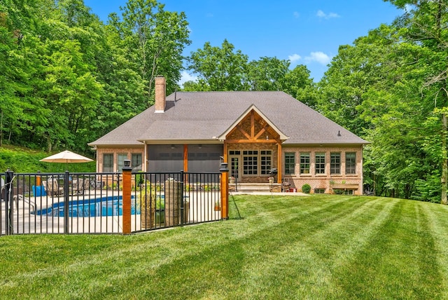 6779 Arno Allisona Rd, College Grove, TN 37046 - rear view of house featuring a patio area, a chimney, brick siding, a sunroom, and roof with shingles