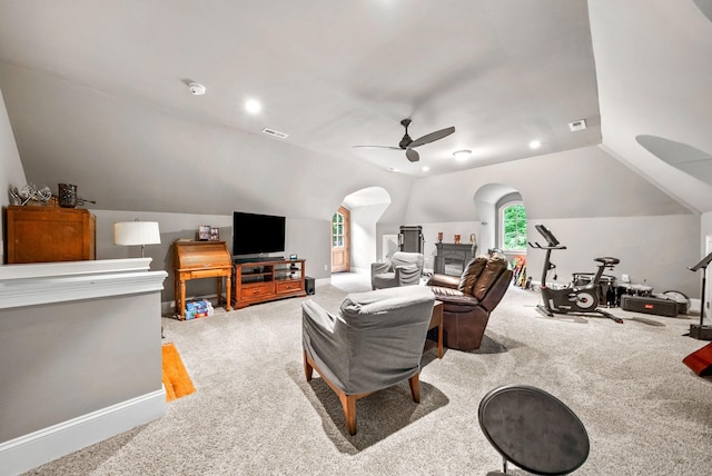 6779 Arno Allisona Rd, College Grove, TN 37046 - living room featuring lofted ceiling, ceiling fan, carpet floors, and arched walkways