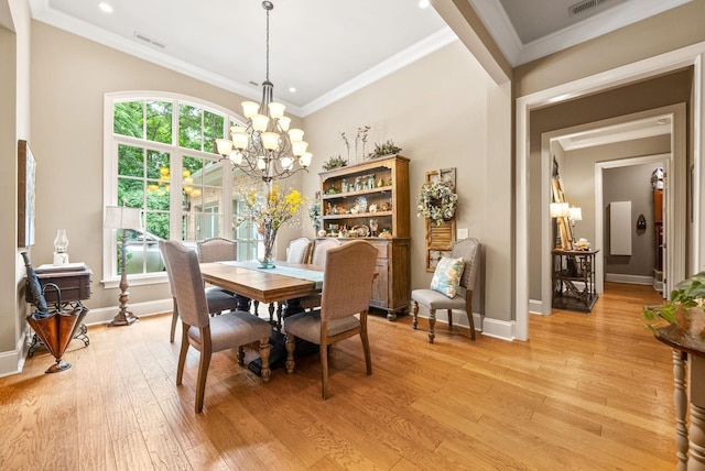 6779 Arno Allisona Rd, College Grove, TN 37046 - dining space with a chandelier, plenty of natural light, light wood-style flooring, ornamental molding, and recessed lighting